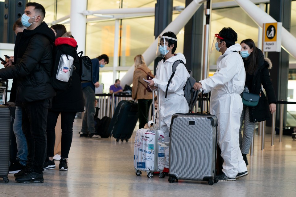 Long queues and passengers wearing hazmat suits have been travelling through Heathrow Airport