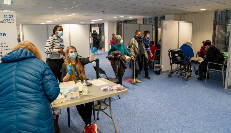 Volunteers at the Wembley vaccination centre, London