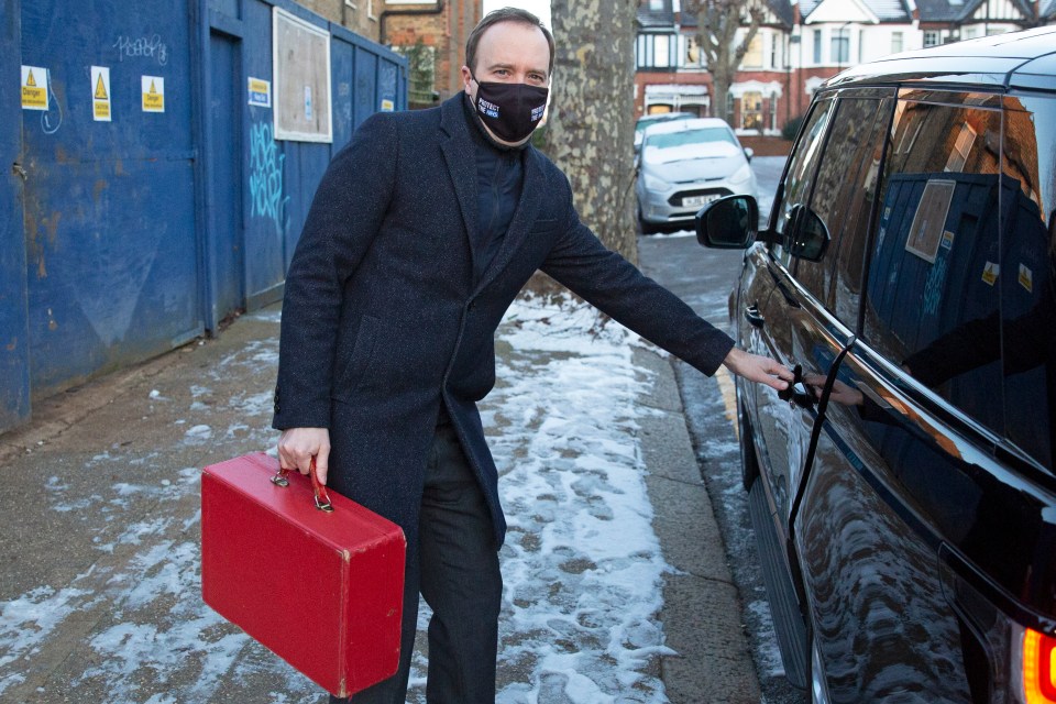 A masked Health Secretary Matt Hancock leaves his West London home on January 25 after self isolating