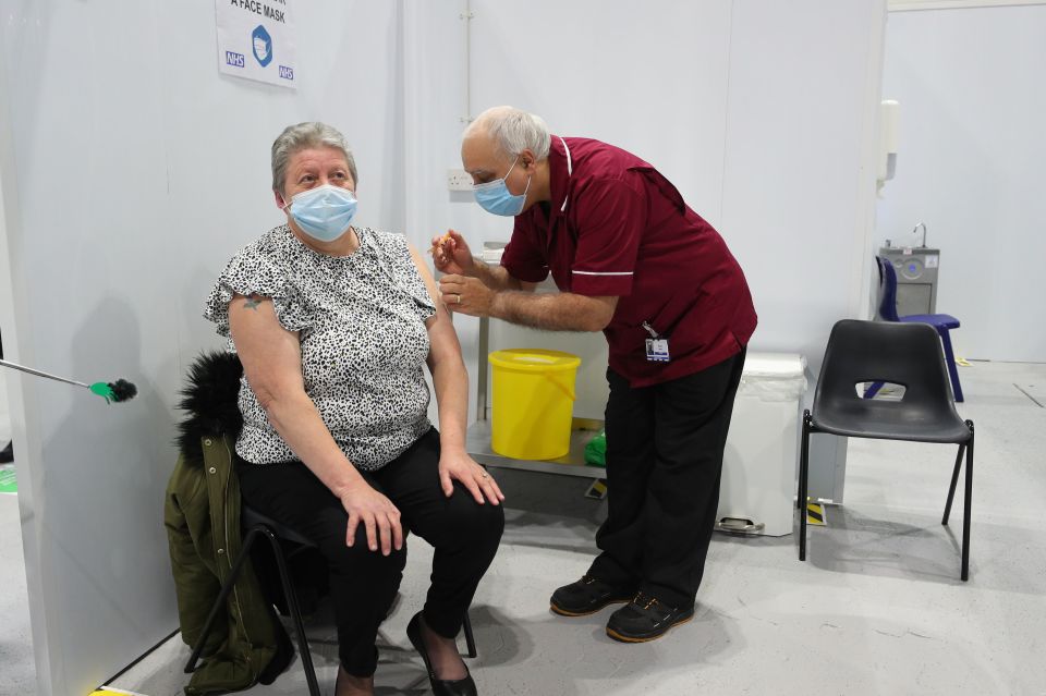 Joanne McLaren was the first patient to receive a dose of the Oxford/Astrazeneca coronavirus vaccine at the Winter Gardens in Blackpool today, January 25. She was injected by Robert Ward, 56, a retired nurse from Blackpool Victoria Hospital