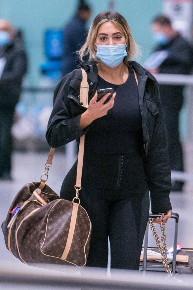 Chloe was spotted in a mask once she touched down in the UK 