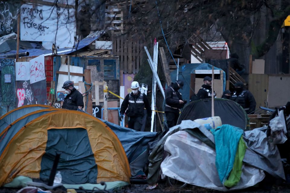 Police could be seen walking through the site