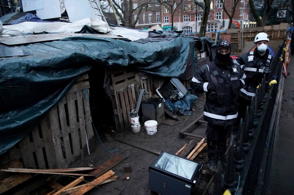 Flimsy wooden posts are seen propping up tonnes of earth in the subterranean lair, right in the heart of central London