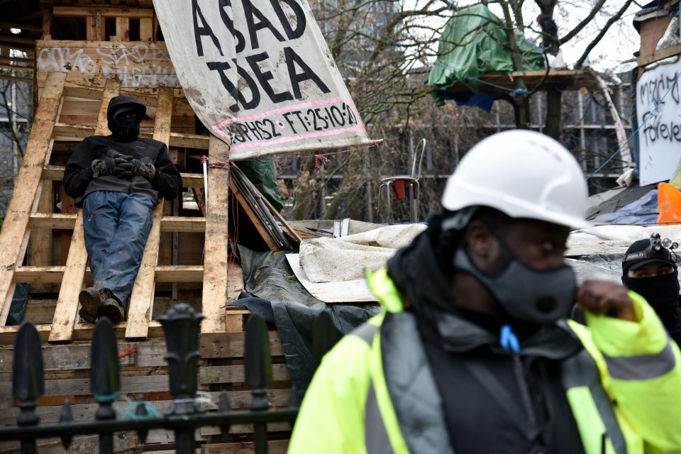 One protester can be seen refusing to move at the campsite