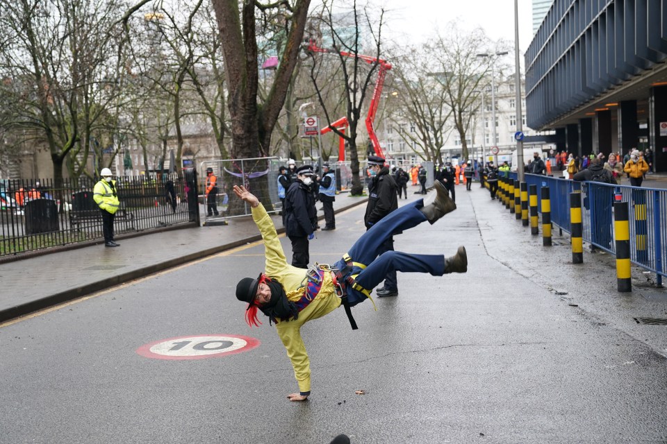 A protester dances as he leaves the site