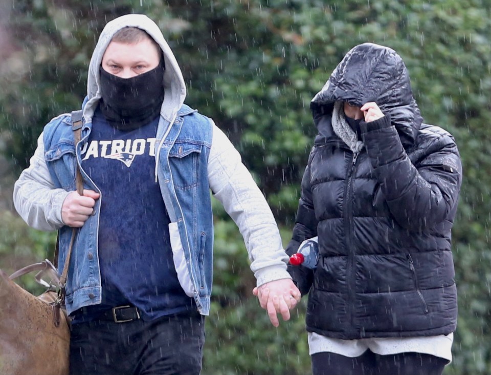 Kandice Barber (right) outside at court with husband Daniel this morning