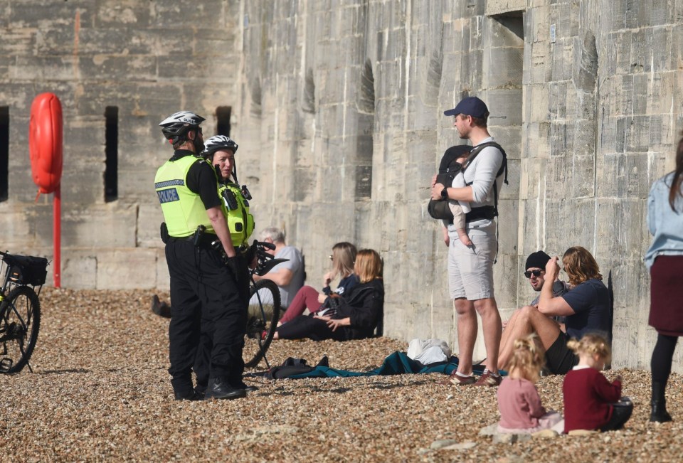 In Portsmouth, police were seen chatting to families and friends sitting by the sea wall