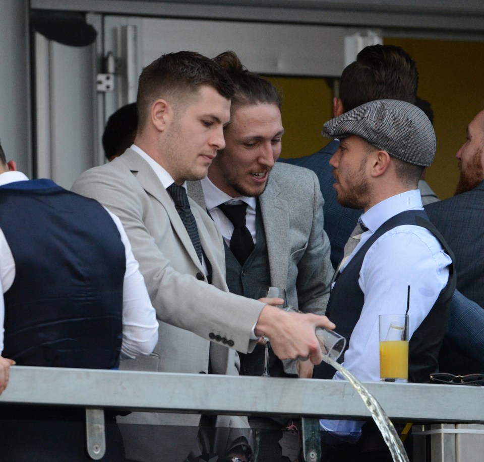 Samir Carruthers and James Collins relieved themselves on a racecourse balcony