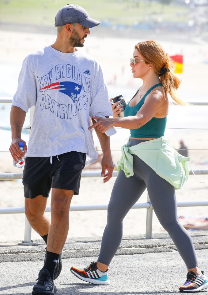 The loved-up couple enjoyed a beach walk in North Bondi