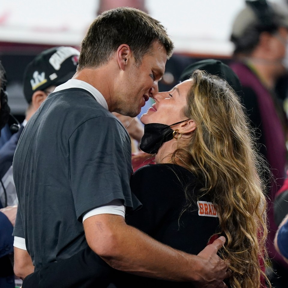 Tom Brady shares a kiss with wife Gisele Bundchen after his latest Super Bowl win