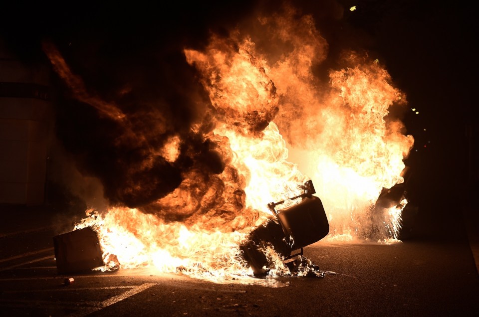 A motorbike set on fire by the rioters in Barcelona