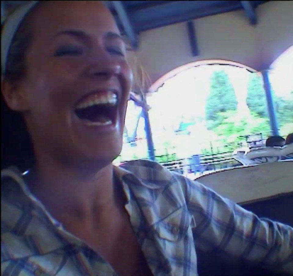 Viewers are also shown footage of her laughing at a theme park