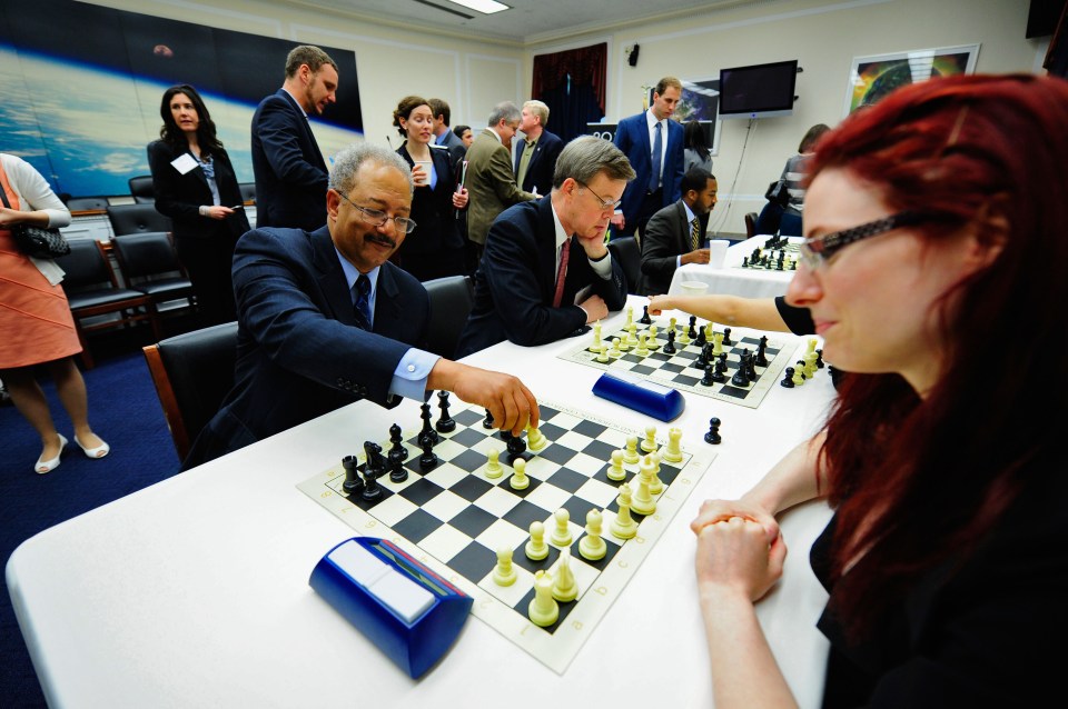 Jennifer (right) shares chess tips with Rep. Chaka Fattah (D-PA) in 2013