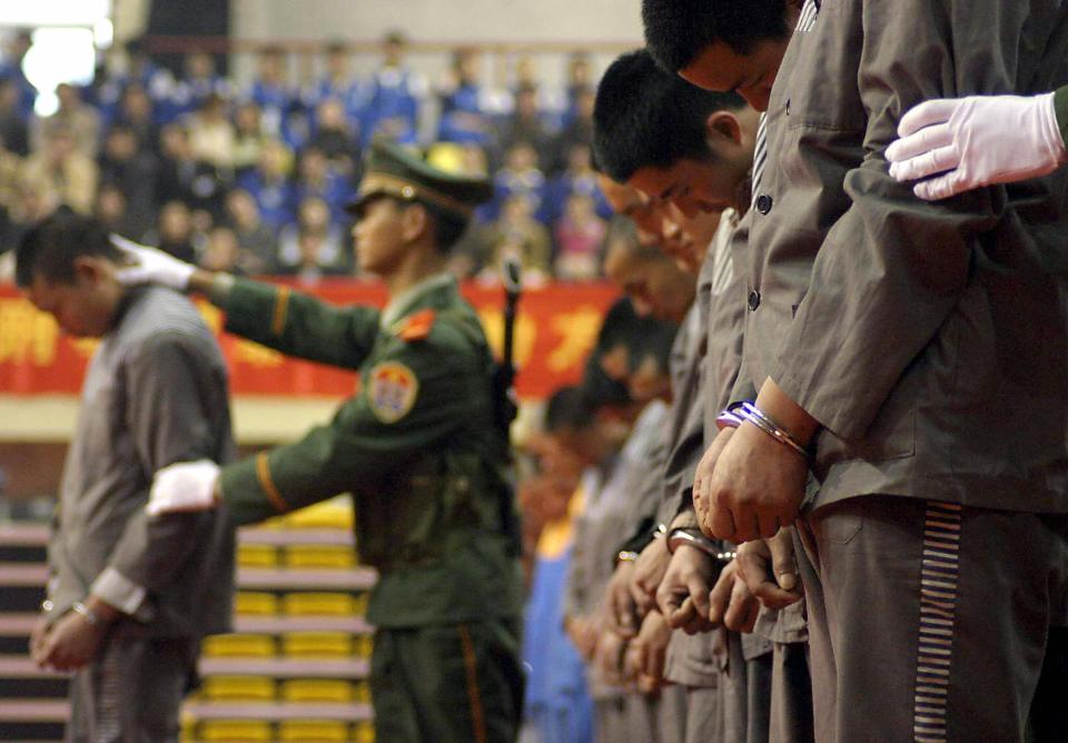 Chinese police show of a group of convicts at a sentencing rally in Wenzhou