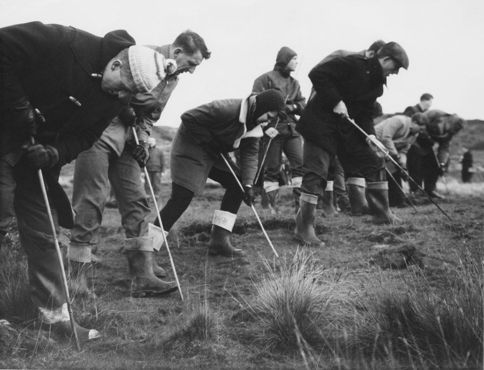 Searchers probing the peat on Saddleworth Moor in the South Pennines in October 1965