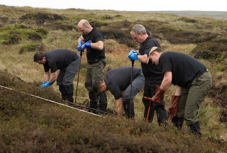 A police search team looks for the body of Moors murder victim Keith Bennett in 2009