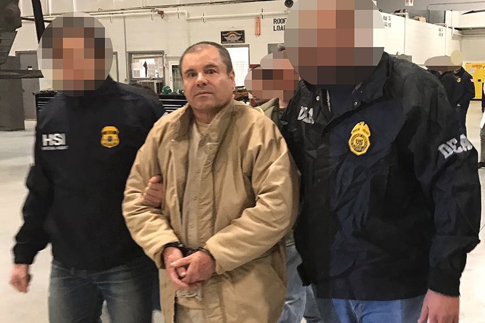 El Chapo, who has been caged for life, is escorted by cops in 2017