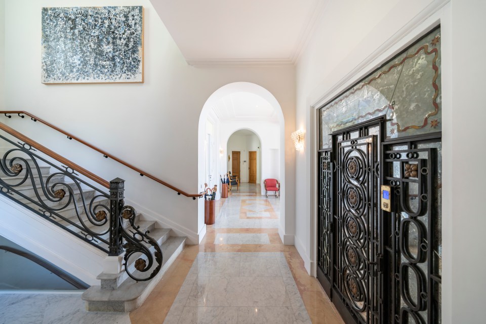 The grand reception and entrance hall is lined with mosaic-tiles