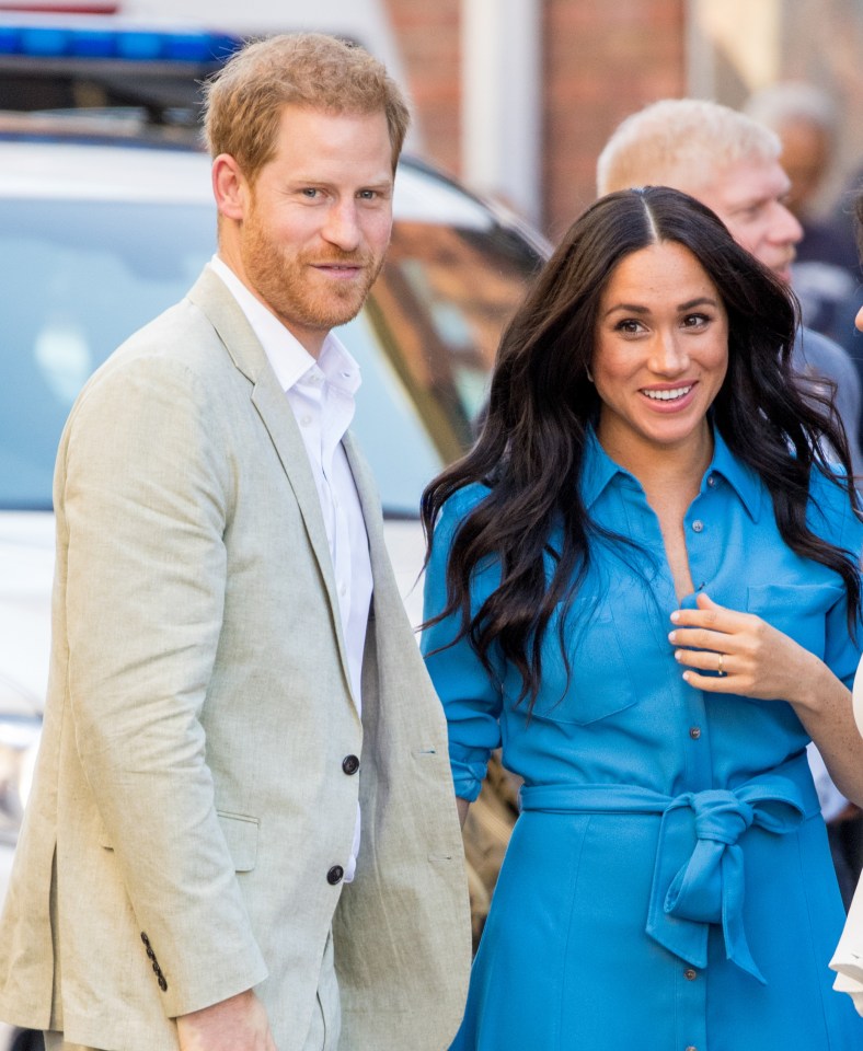 The Duchess with husband Prince Harry