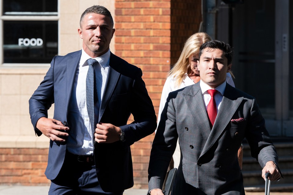 Former England rugby star Sam Burgess (left) arriving at court before he was found guilty of intimidation