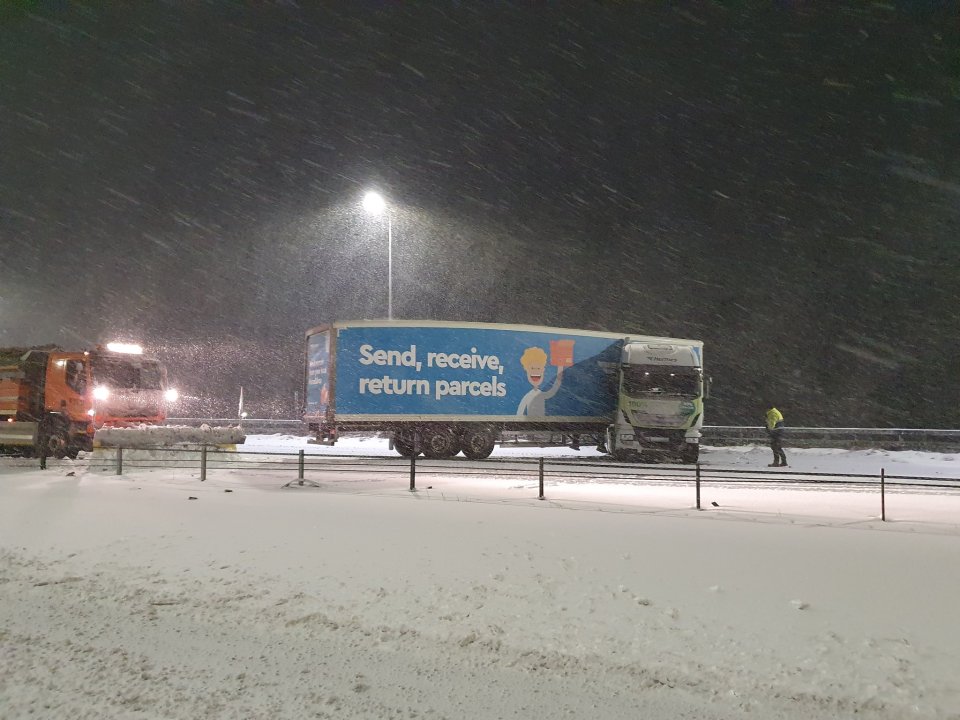 A jack-knifed Hermes delivery lorry blocks all three lanes on the M62 near Saddleworth