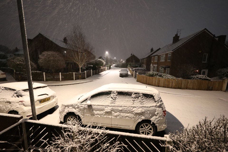 Overnight snow covers cars in the Woodlesford area of Leeds