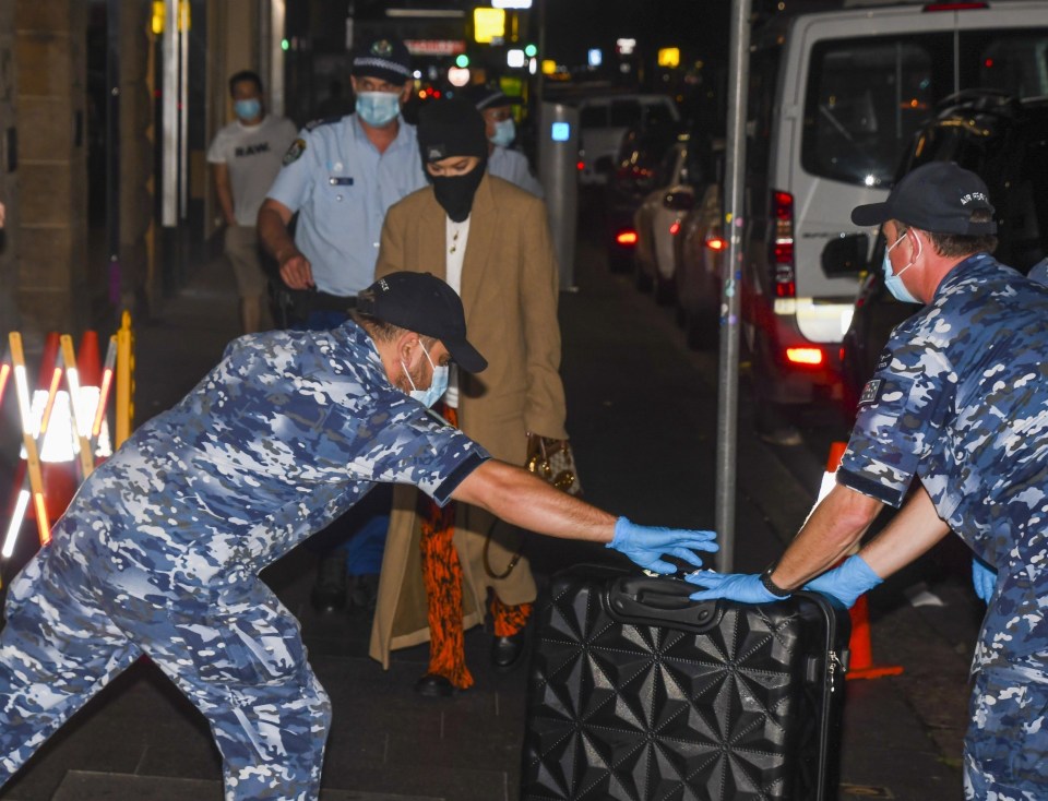 Airport workers wore protective gloves as they handled Rita's luggage