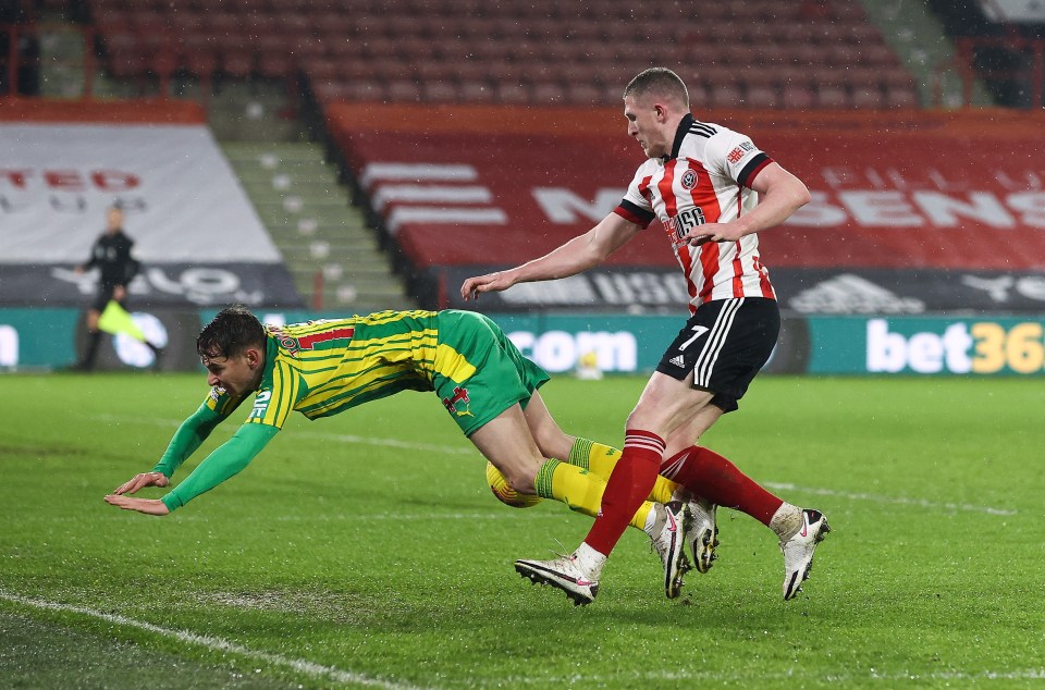 West Brom's Bazilian midfielder Matheus Pereira tangles with Sheffield United counterpart John Lundstram  