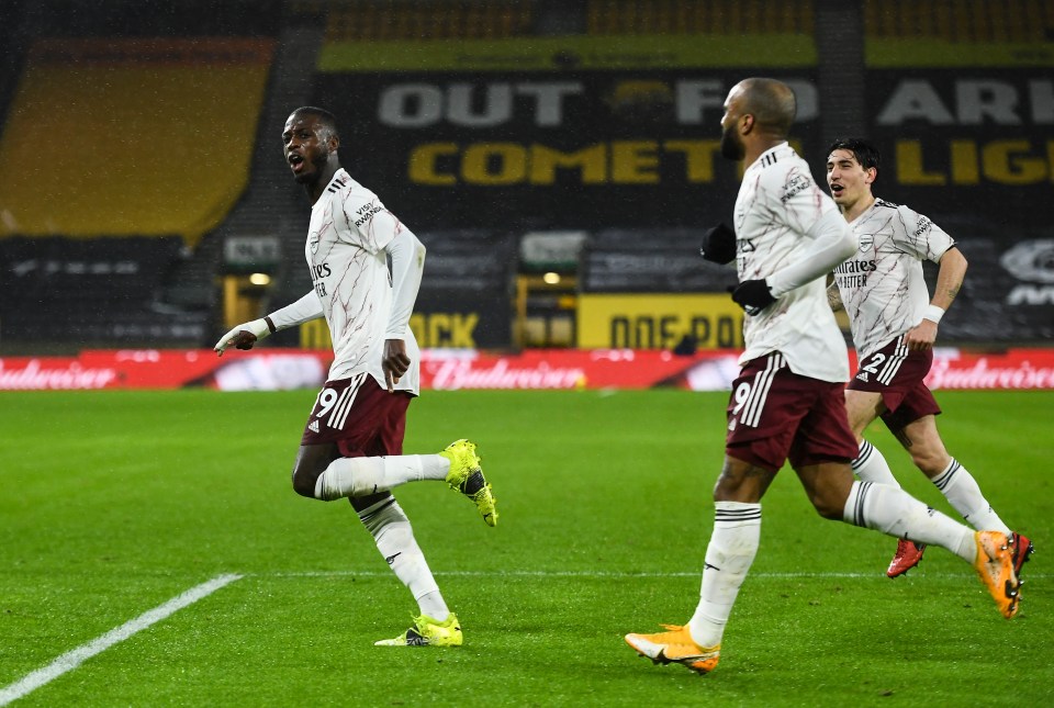 The Arsenal man celebrates after his stunning strike