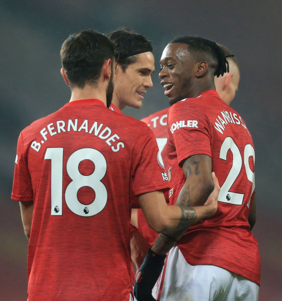 Bruno Fernandes and Edinson Cavani help Aaron Wan-Bissaka celebrate his Man Utd opener