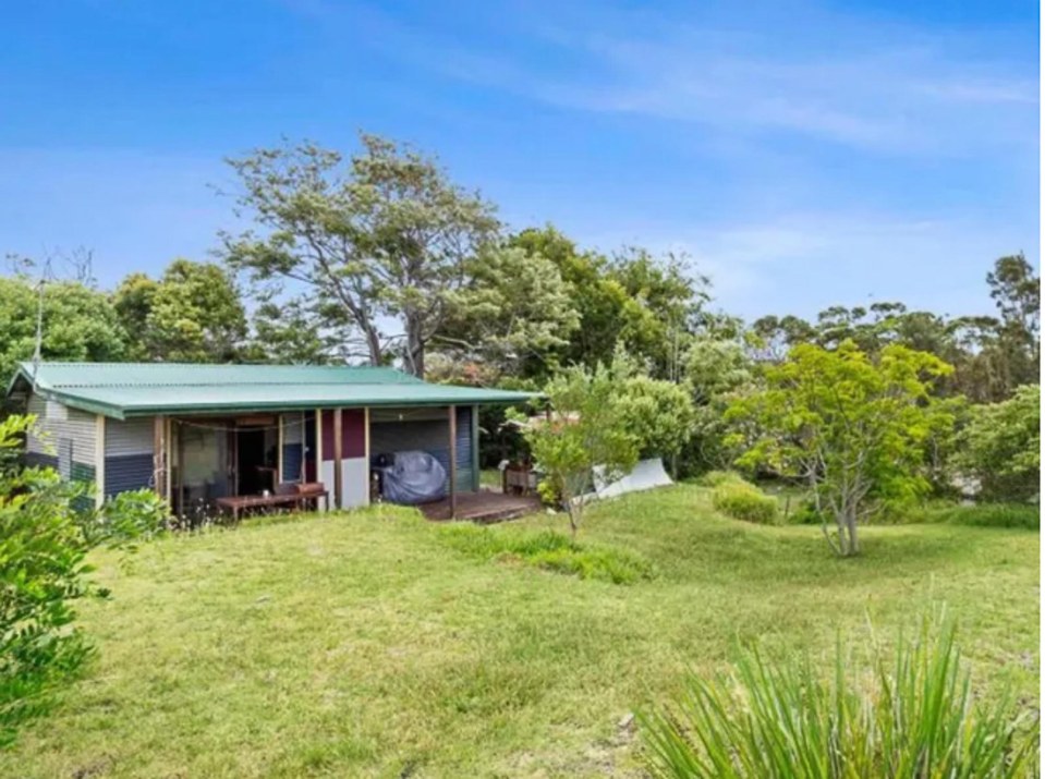 The modest shack is set on half an acre of sought-after land by the beach