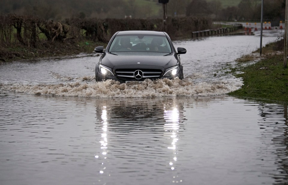 A car struggling through the floods in Windsor