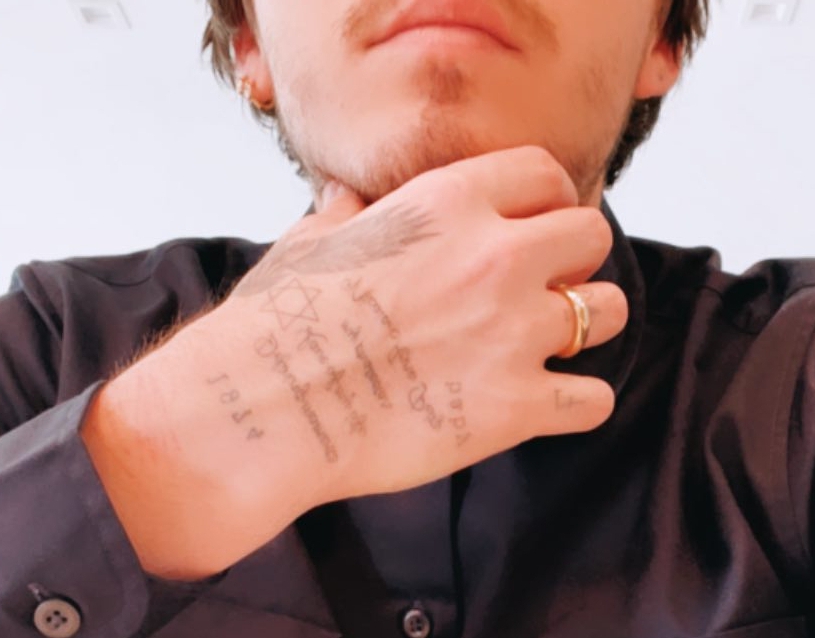 The latest inking is on his hand, including her full name 