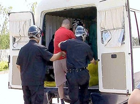 Pictures allegedly showing Chinese officials loading a man into the back of an 'execution van'