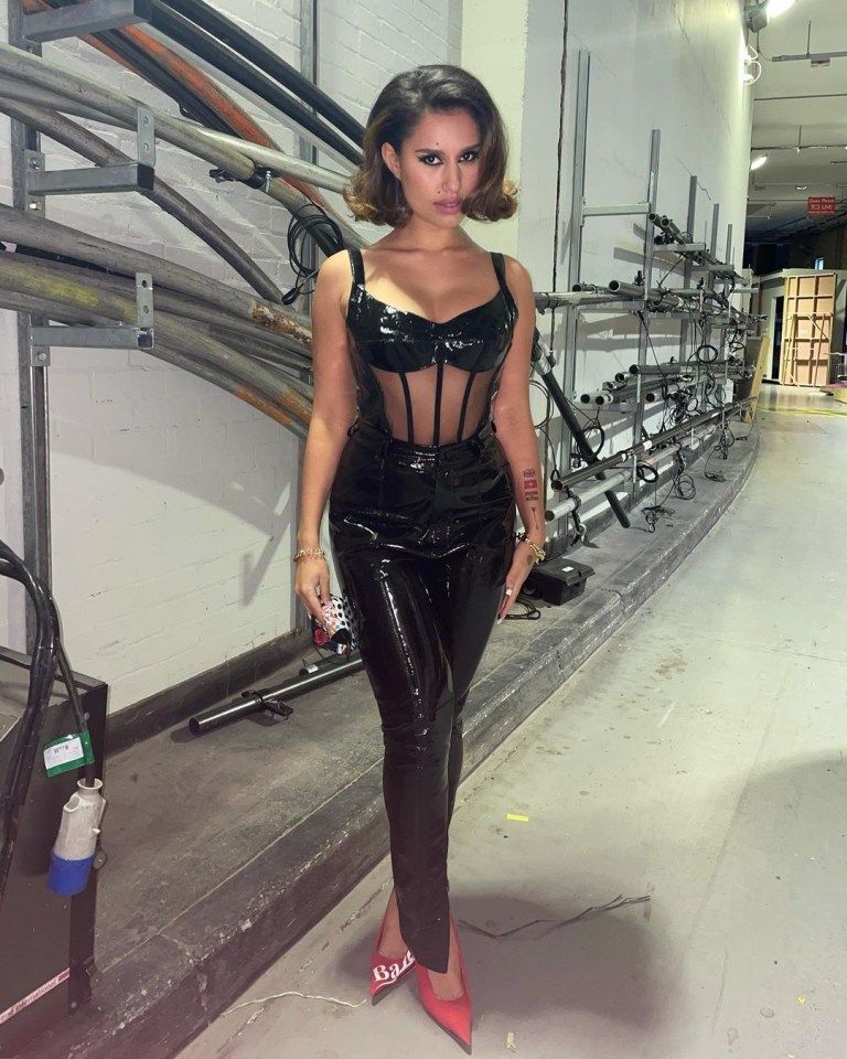 Singer Raye appeared on Sunday Brunch in black latex trousers