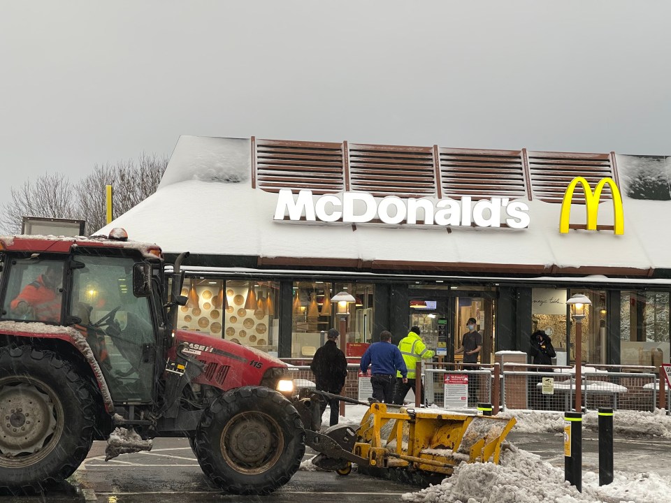 Drifts of snow were cleared from the car park of a McDonald's in Kent