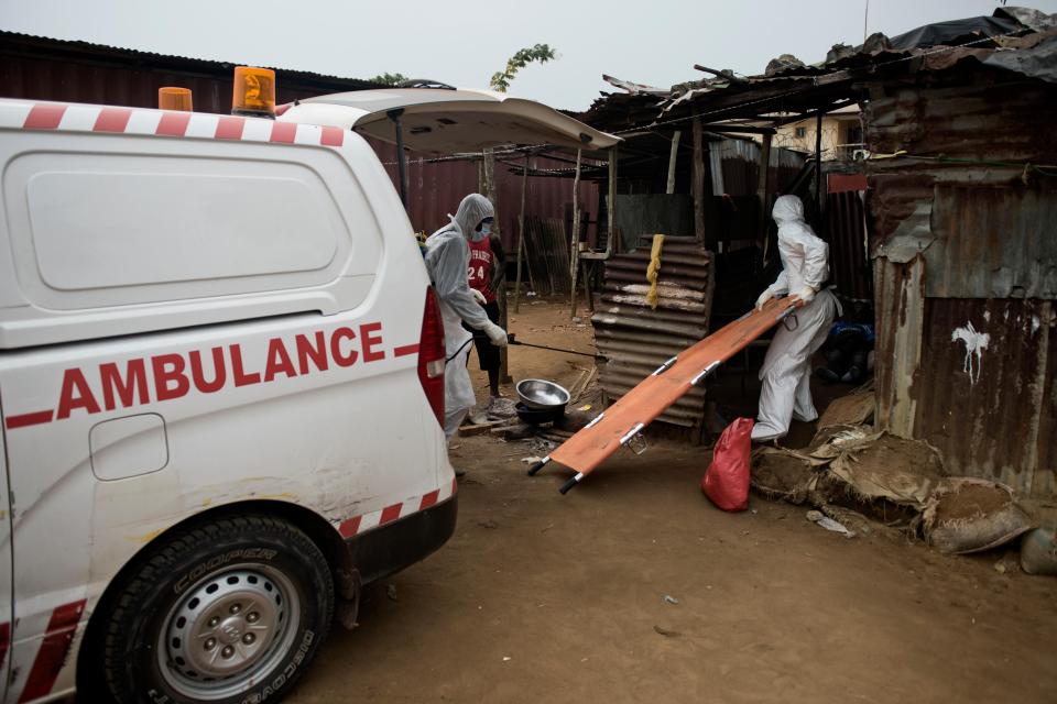 Volunteers removed an Ebola victim's body from a house near Liberia's capital Monrovia in 2015