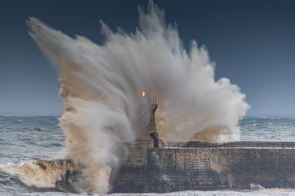 Huge waves break over South Shields Pier in Tyne and Wear