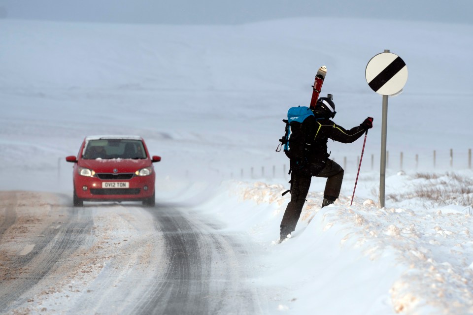 One pedestrian using a snow pole in Saddleworth, Lancashire