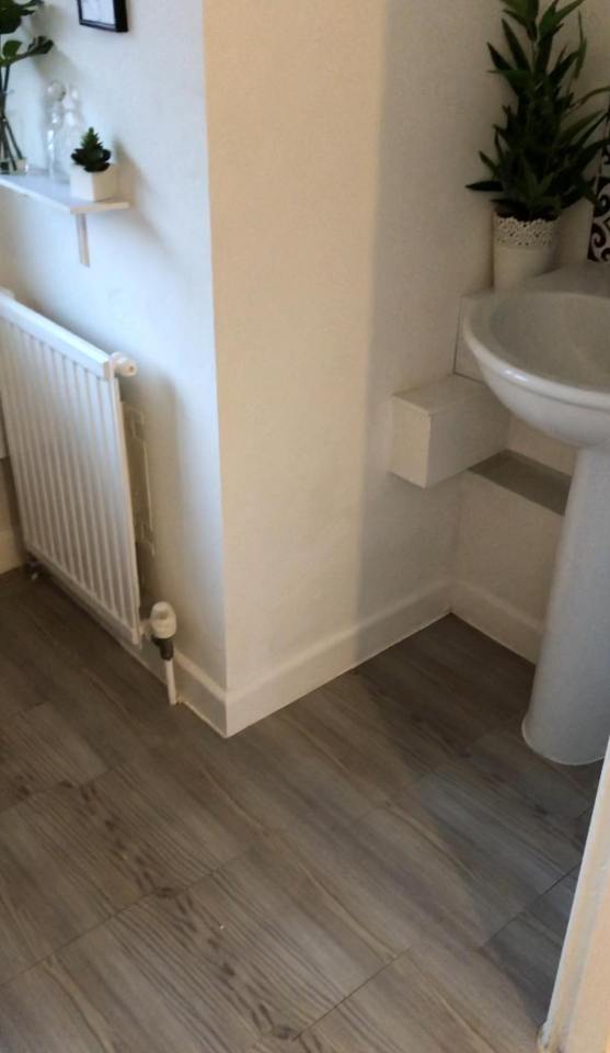 The woman's bathroom floor was instantly  transformed and it's so easy to do