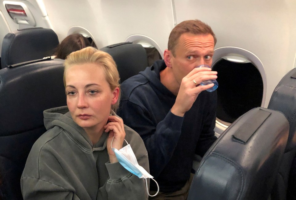 Alexei Navalny and his wife Yulia Navalnaya are seen on board a plane during a flight from Berlin to Moscow, January 17 after recovering from the poison attack