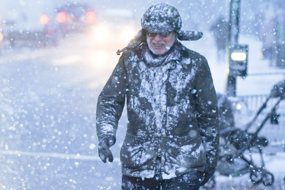 A man walks as he battles through a blizzard in Sheffield