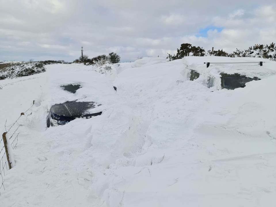 Cars were buried in the snow and abandoned in Crete Road near Folkestone this morning