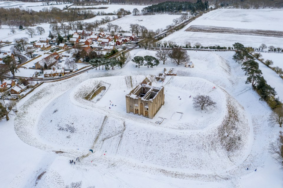 People sledging by Castle Rising in Norfolk which borders the Sandringham Estate