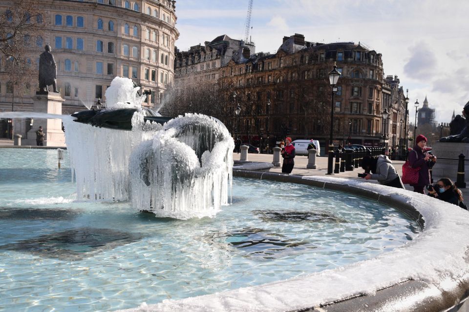 Ice covered statues in the fountains at Trafalgar Square in London