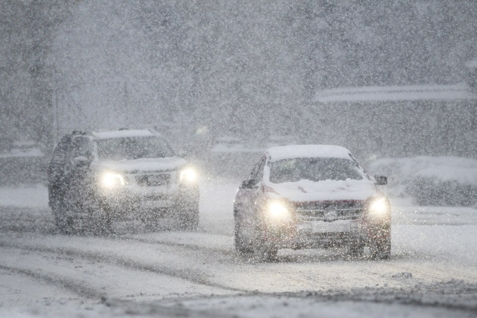 A car is seen driving through the snow in Kelso, Scotland