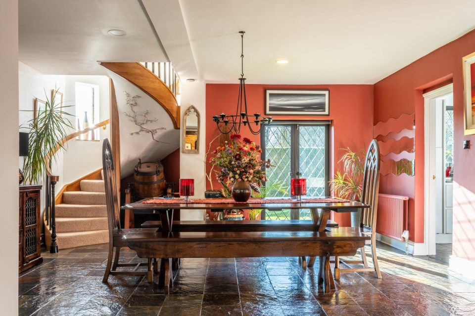 This dining room also features one of the house’s two spiral staircases