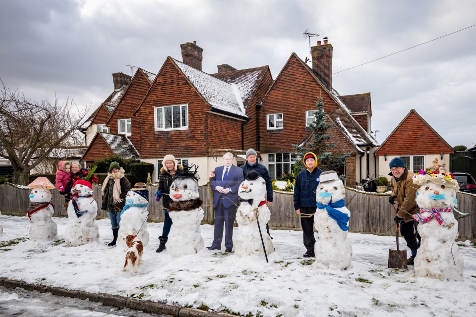 Neighbours in Frinton, Essex, built 13 snowmen when the cold snap hit earlier this month