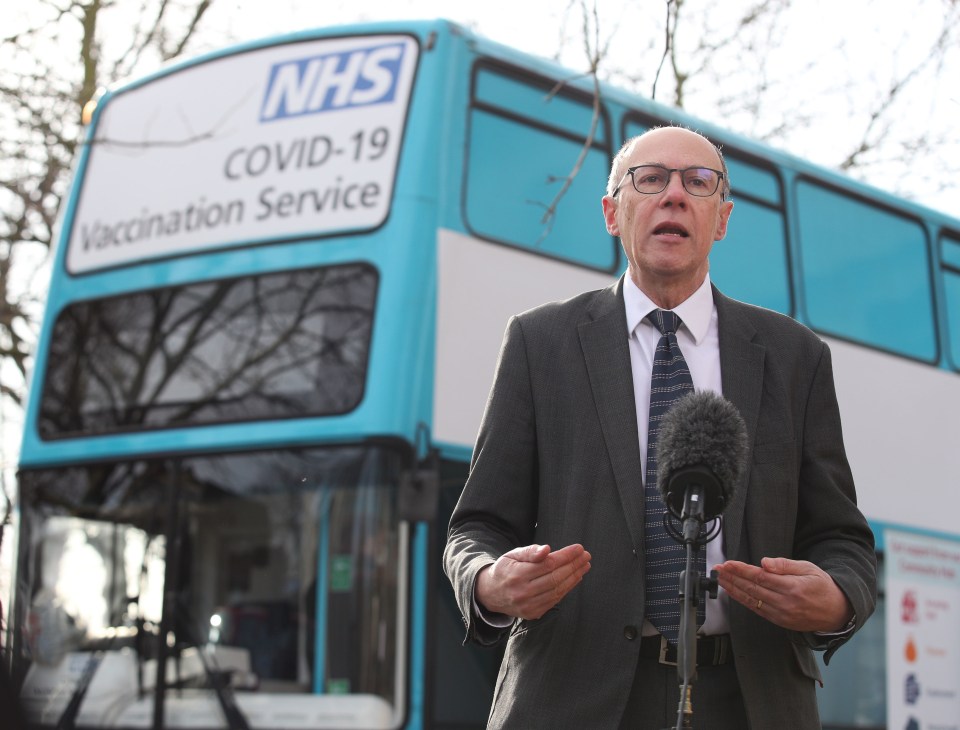 NHS England National Medical Director Stephen Powis alongside a mobile vaccination unit in Greenwich yesterday