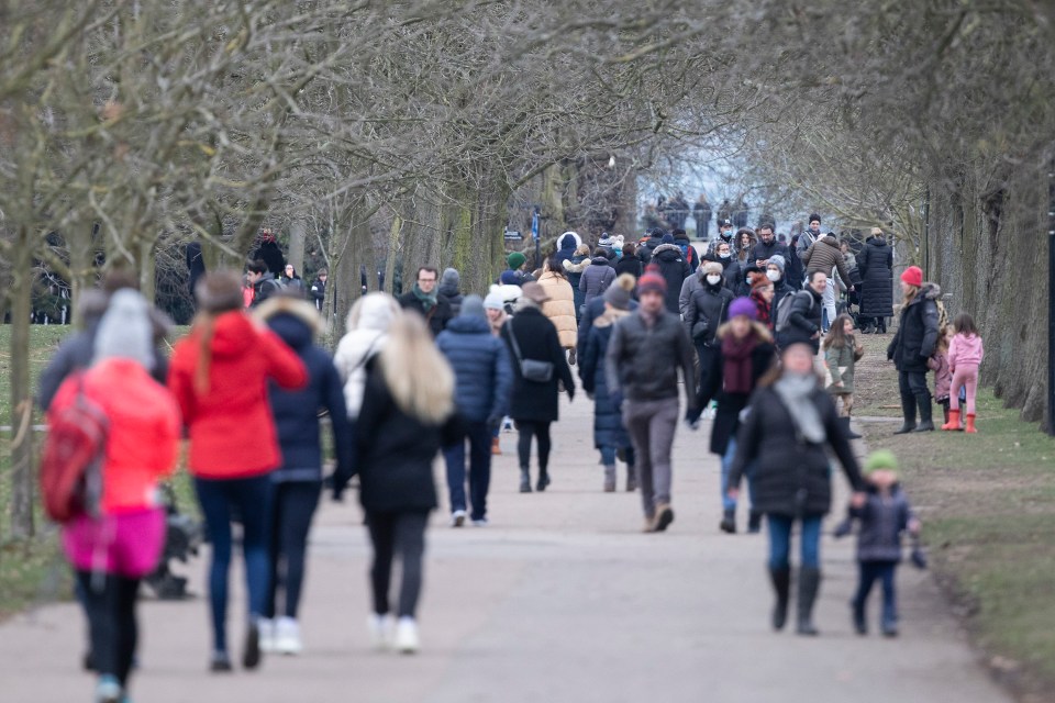 Members of the public exercise in a busy Greenwich Park in South East London